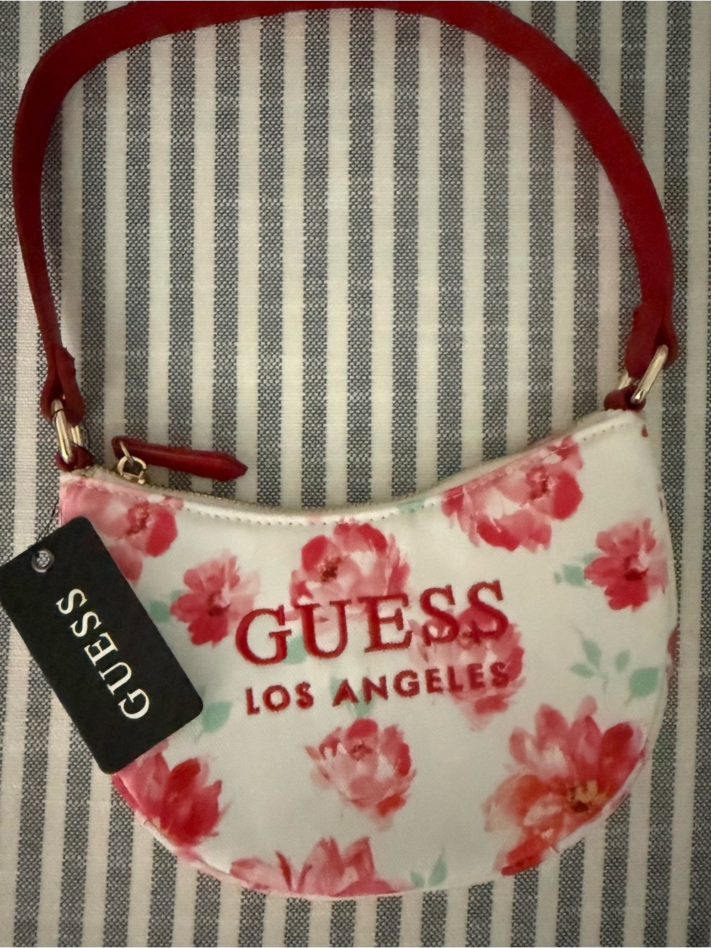 GUESS White Floral Crescent Mini Wristlet with Red Accents